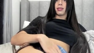 long black Hair Transgirl Tugs Her humongous weenie On cam